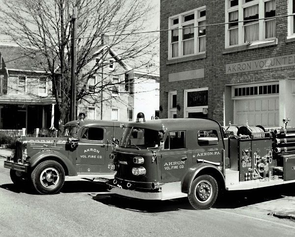 Older black and white photo of Akron Fire equipment.