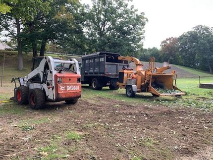 sepe tree service workers clearing a lot from tree debris in RI