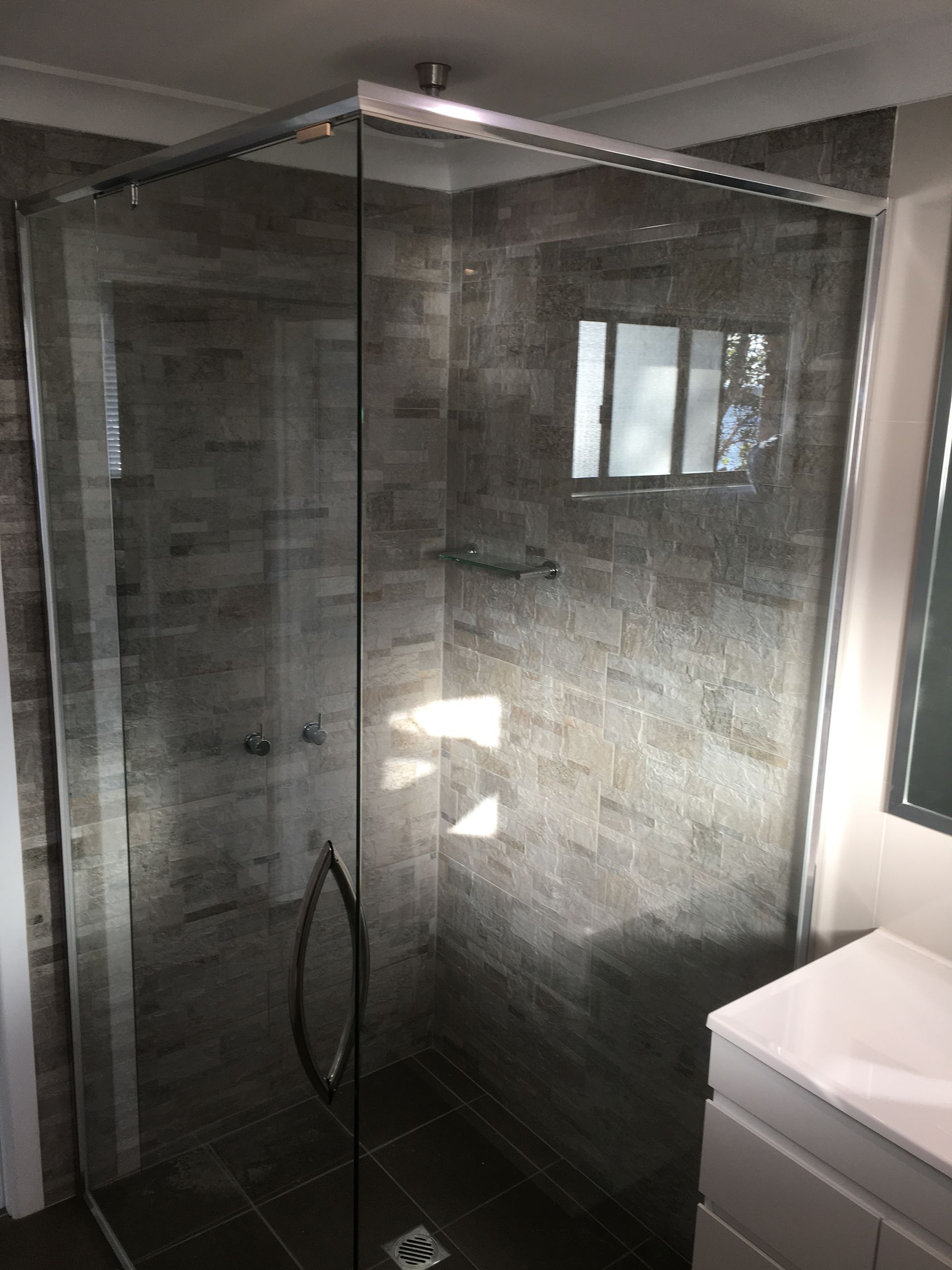 A Bathroom With a Walk in Shower and a Bathtub β Patterson Glass Works in Kempsey, NSW