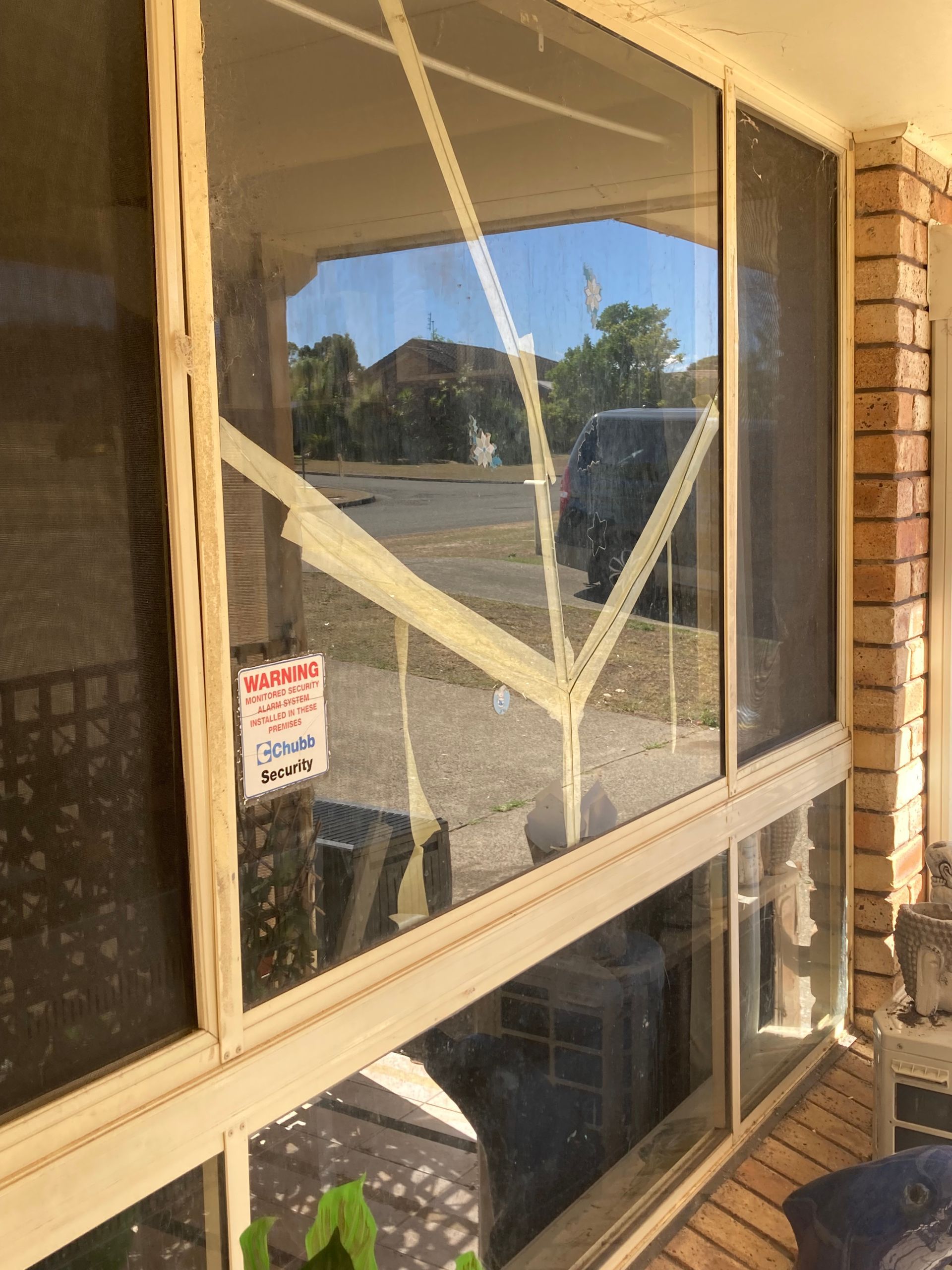 Patched up glass window— Patterson Glass Works in Kempsey, NSW