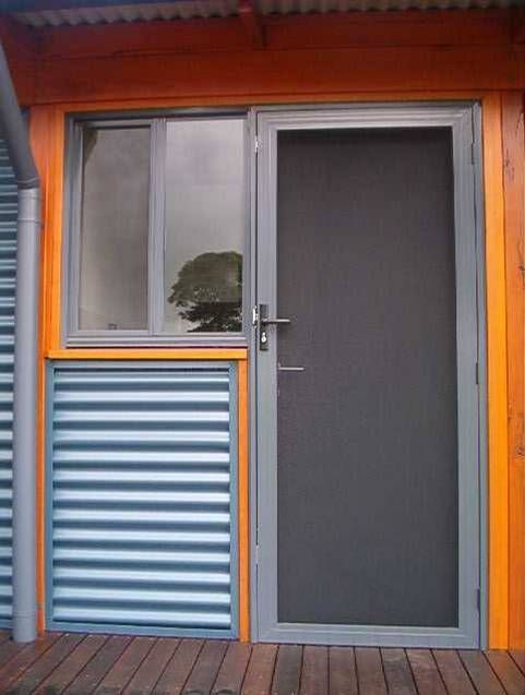 Invisi door with corrugated walls — Patterson Glass Works in Kempsey, NSW