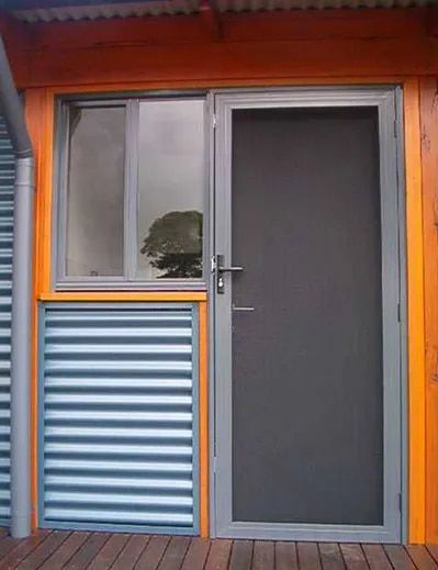 A Door With a Screen and a Window on the Side of a Building — Patterson Glass Works in Kempsey, NSW