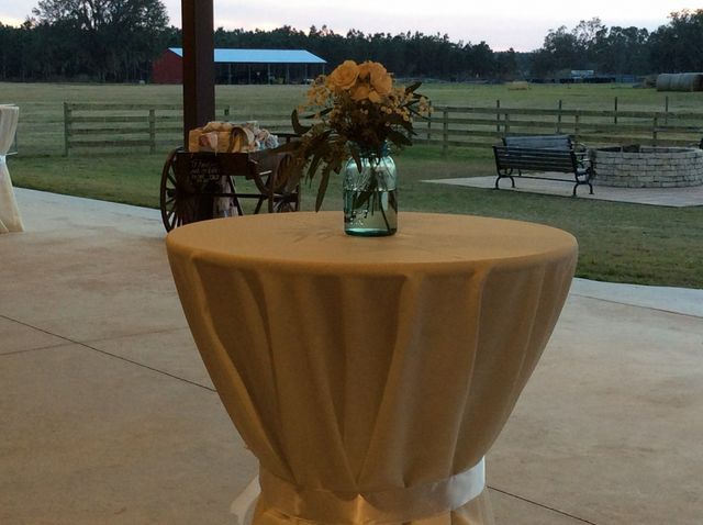 A table with a vase of flowers on it