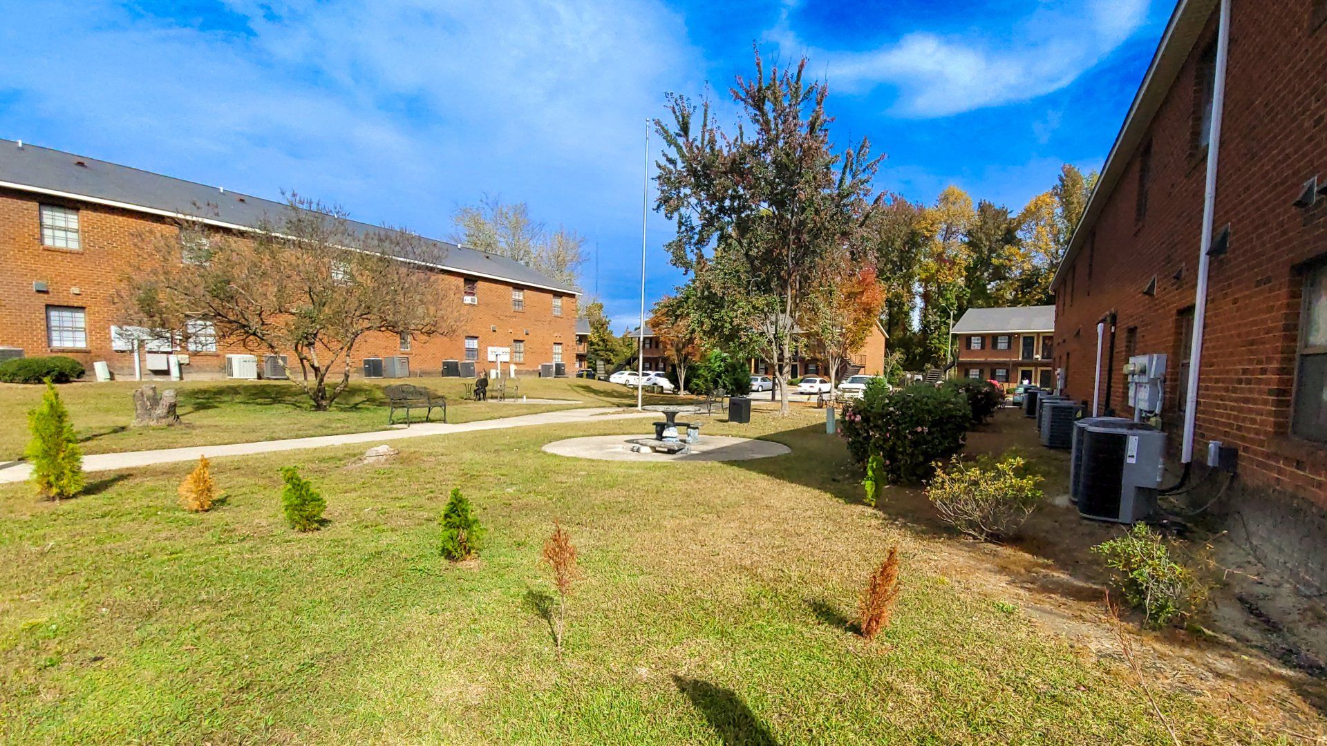 Exterior of complex with large green space