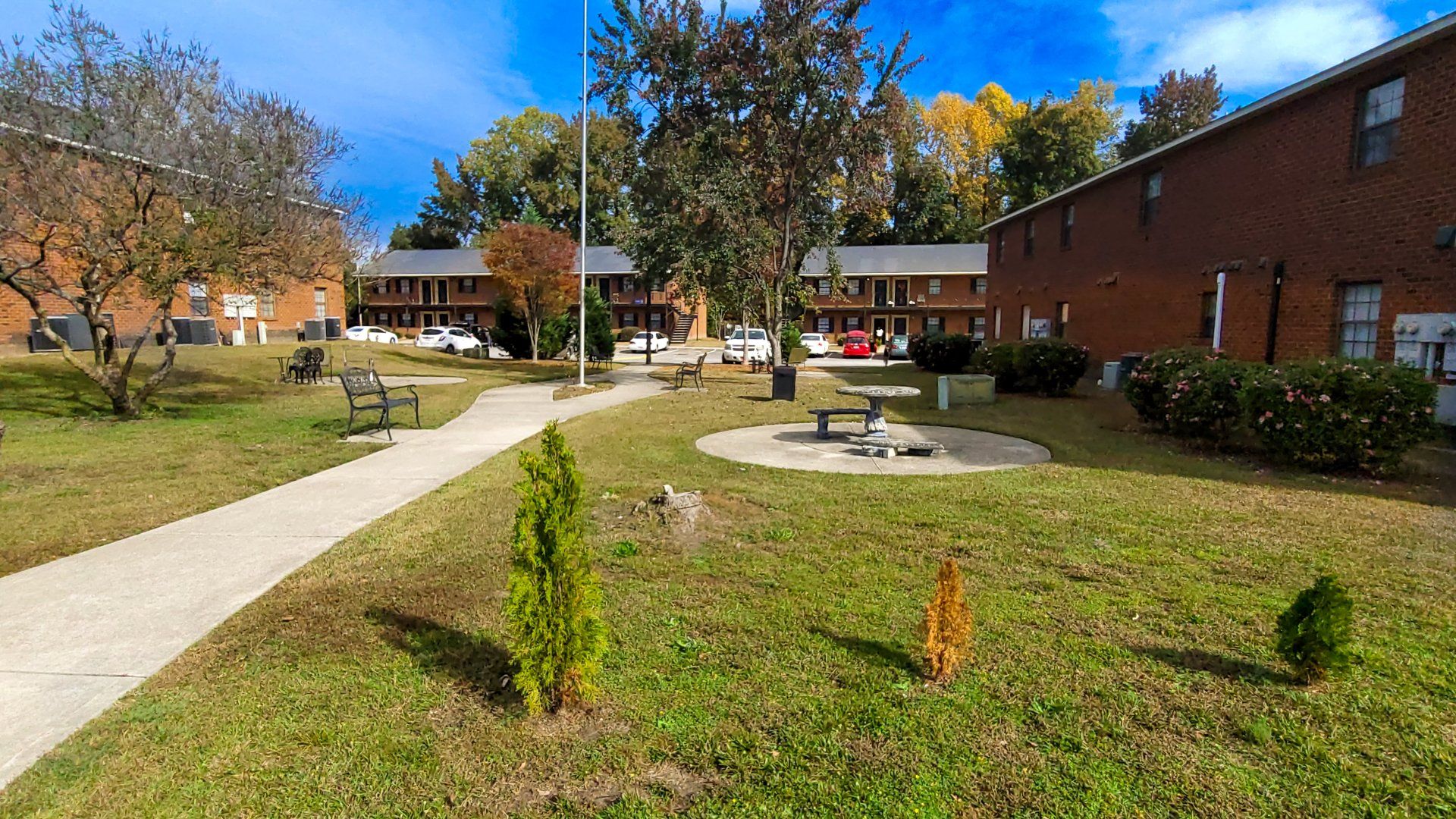 Exterior of complex with large green space