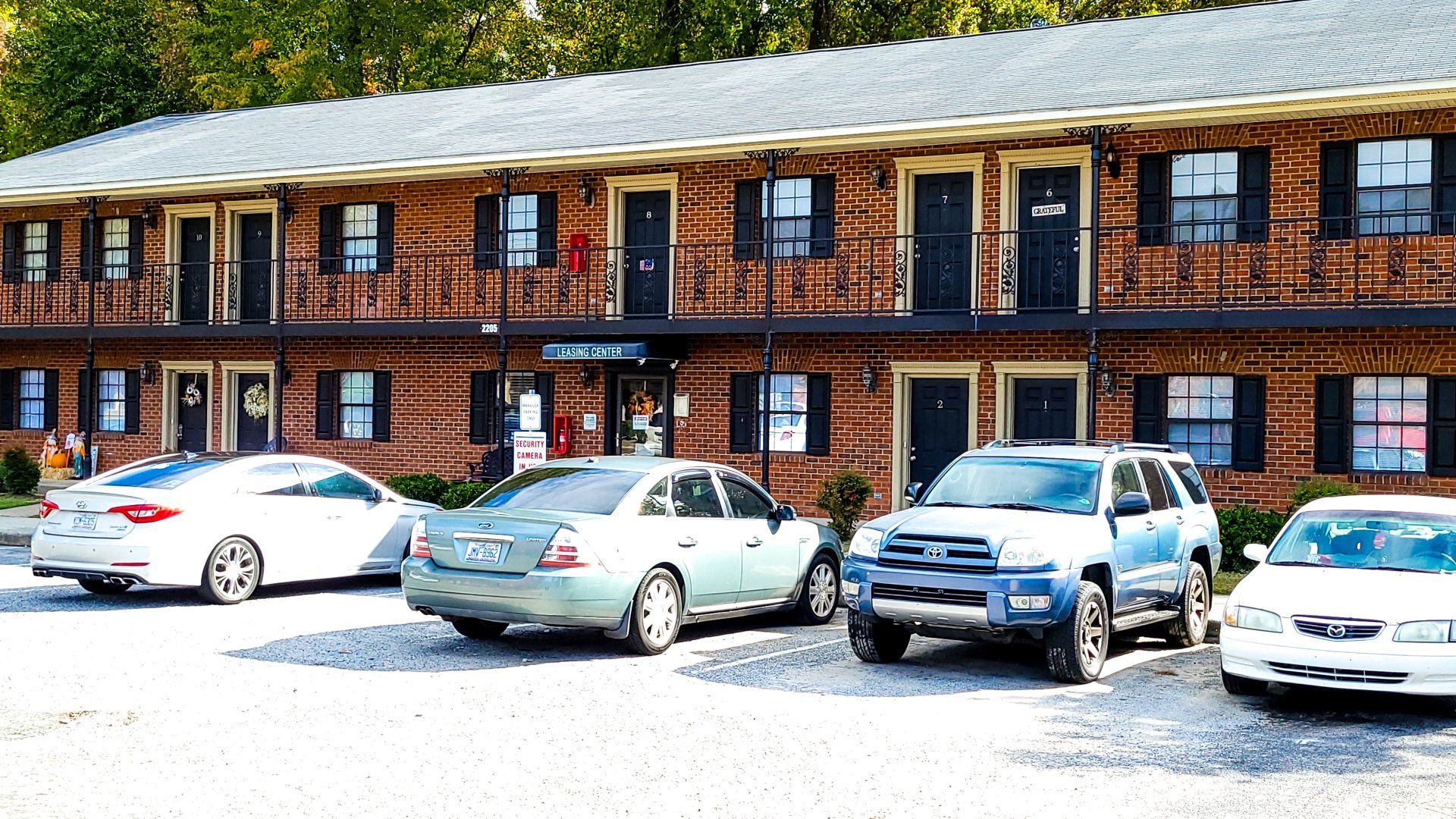 Exterior of complex with parking lot