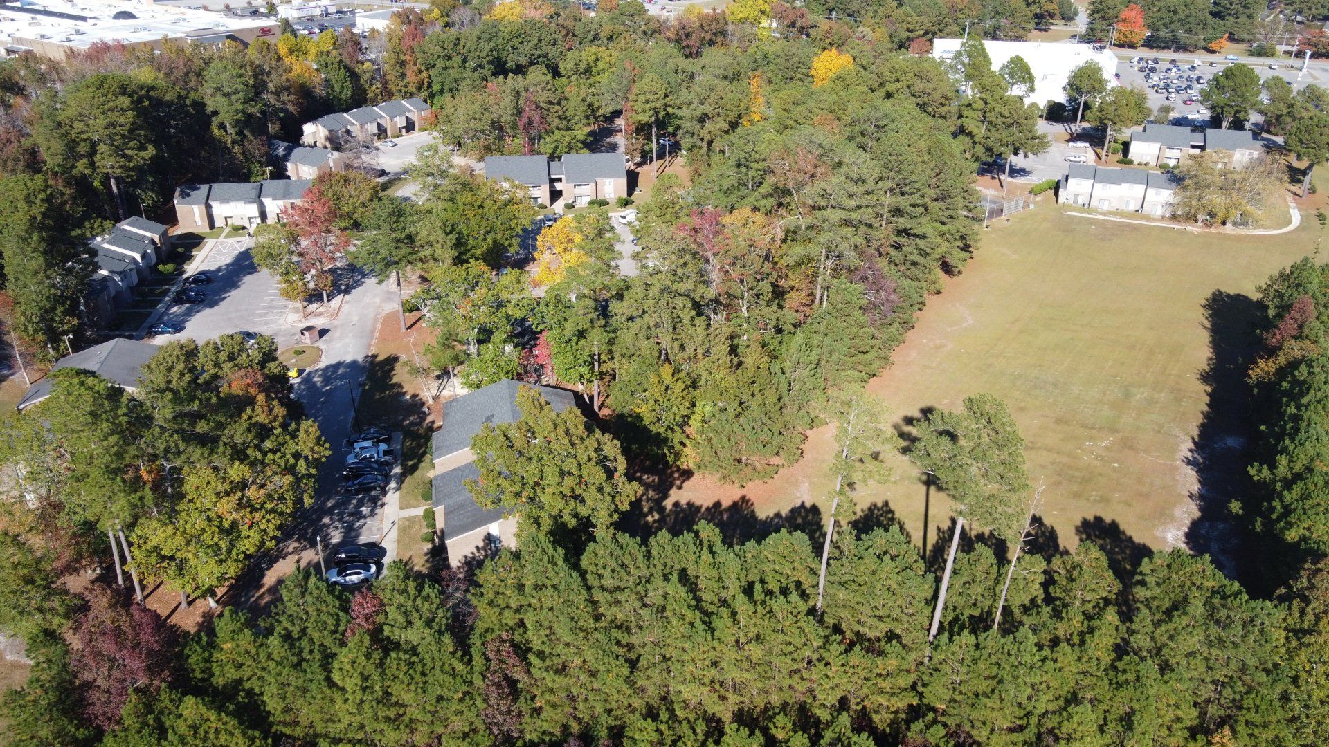 Aerial view of complex with lots of trees