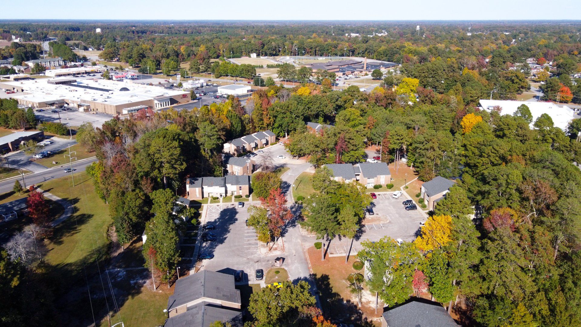Aerial view of complex with lots of trees