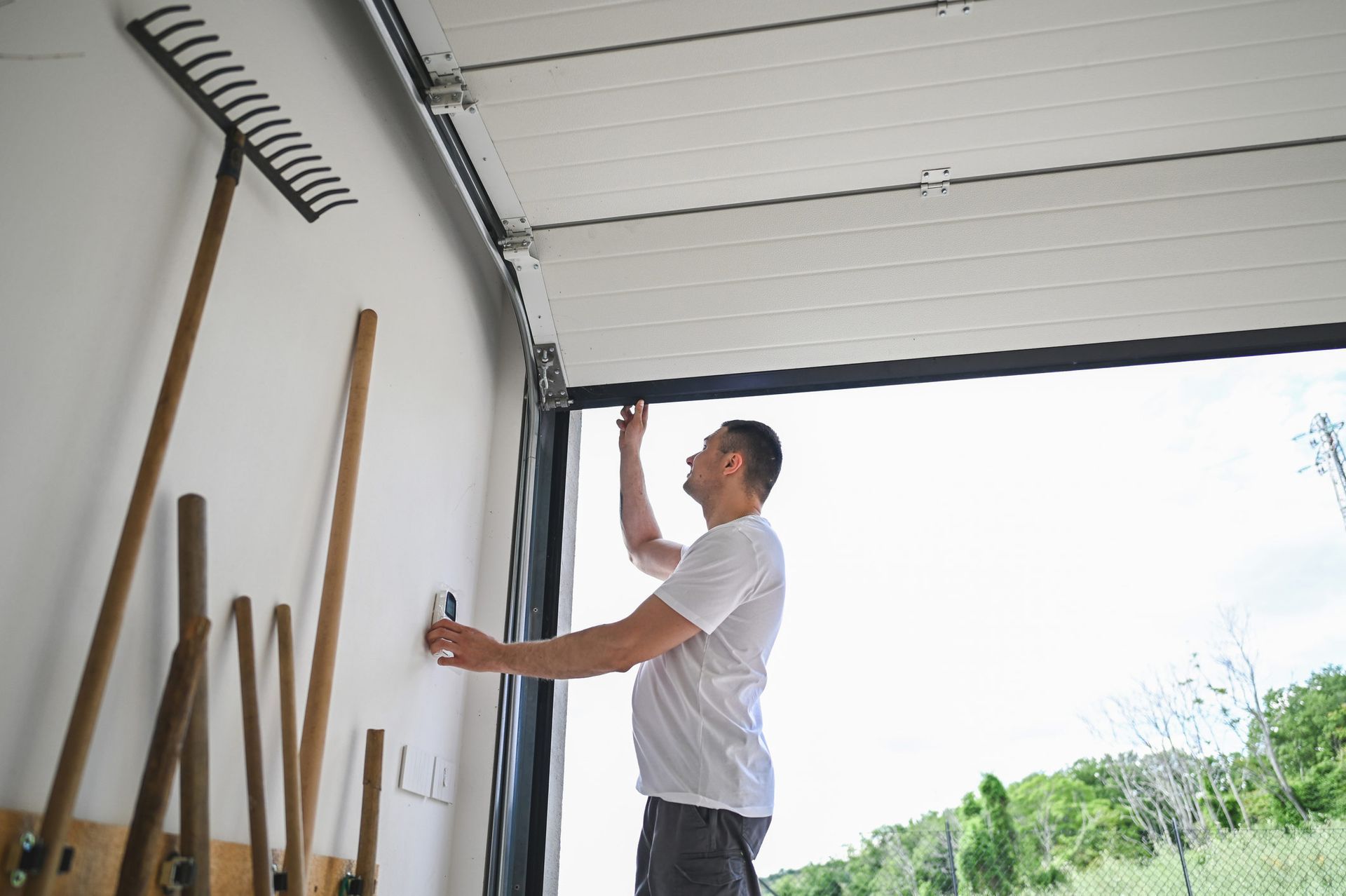 Man working on garage door Man working on garage door