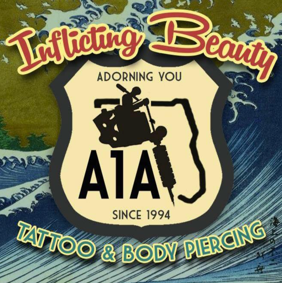 A1A tattoo and body piercing shop logo with a tattoo machine, bold red and black text on a shield.