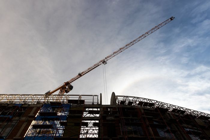 a mobile crane on a building