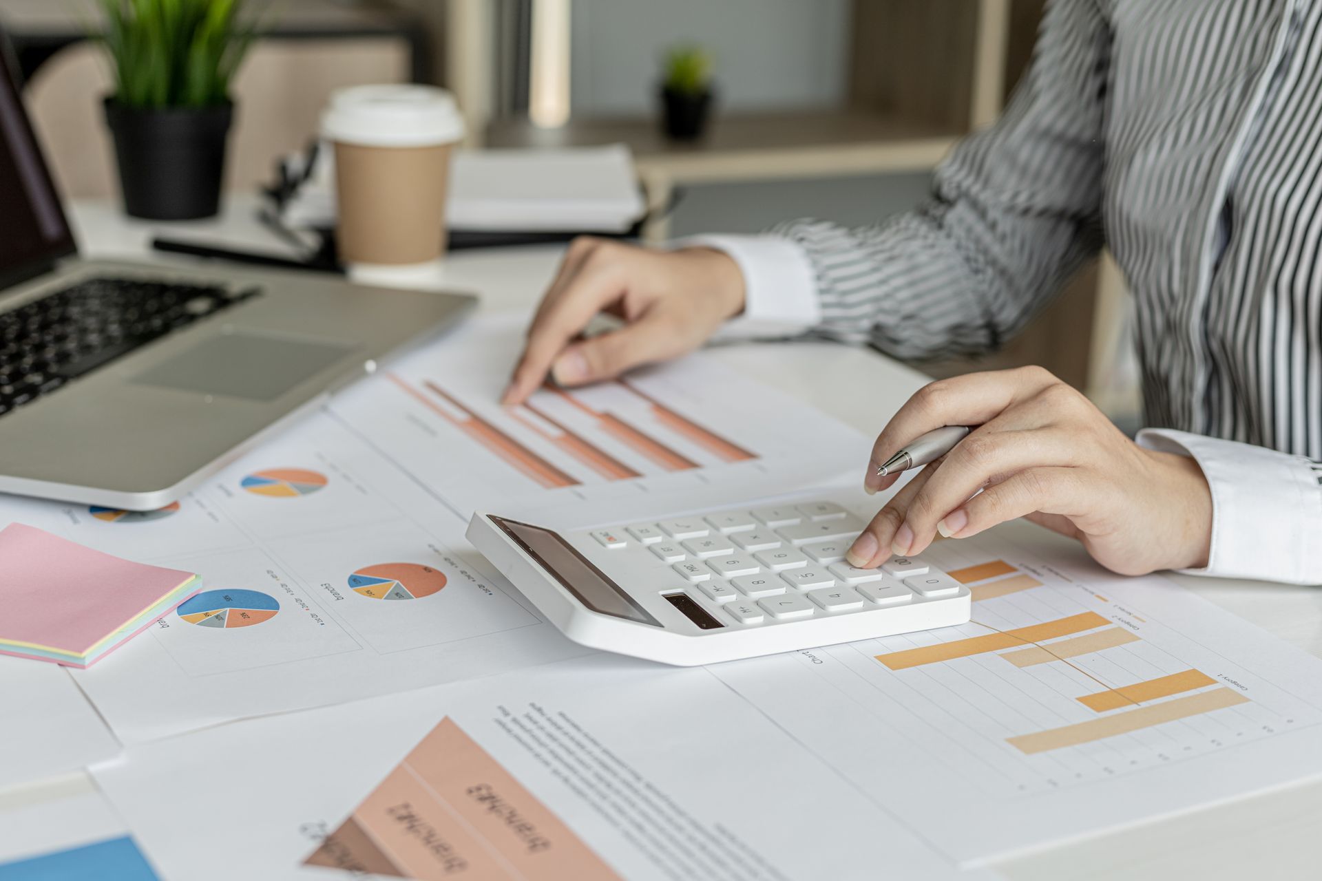 A corporate financier is checking financial documents for the correctness of the financial statements