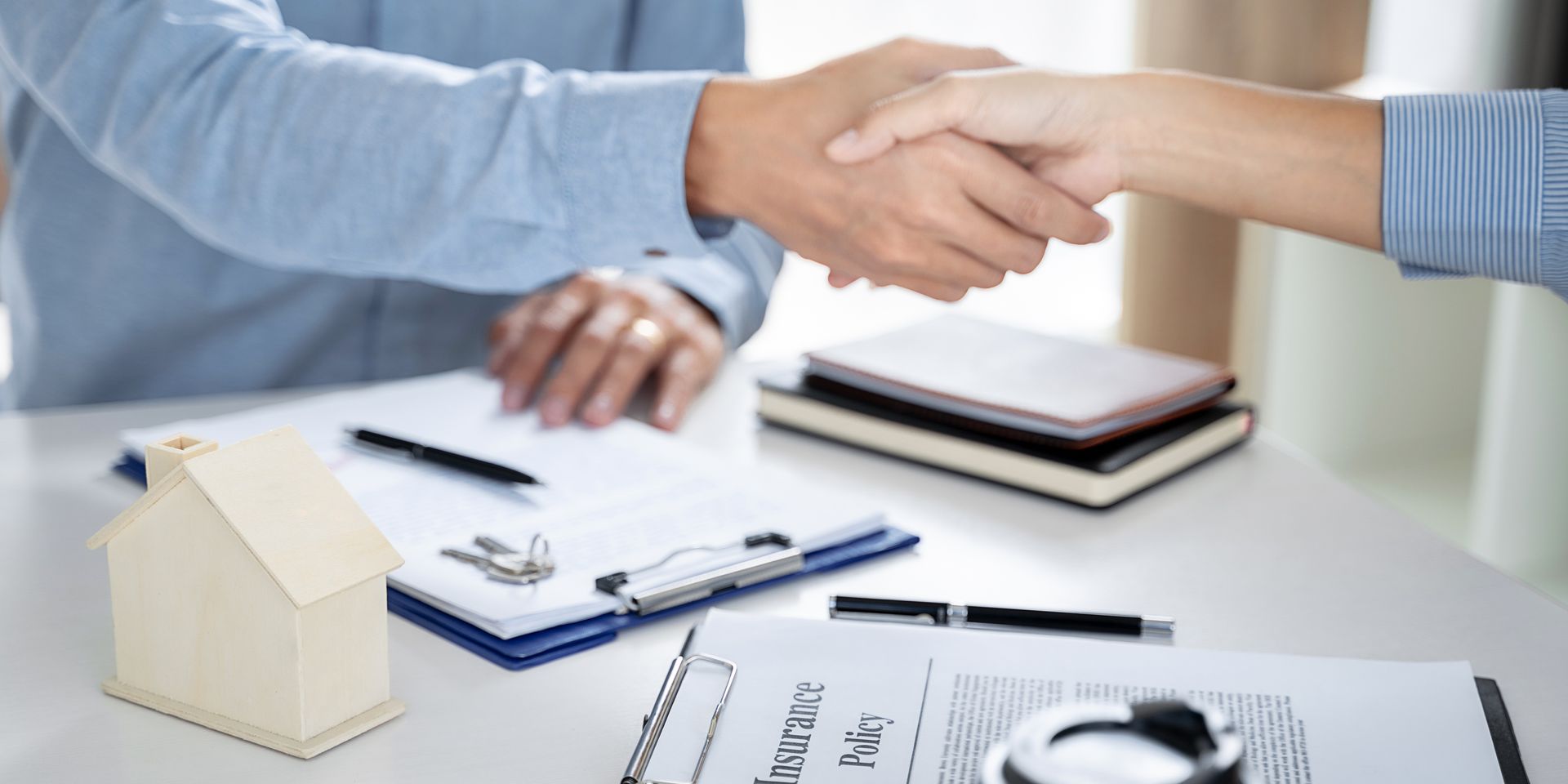 Real estate broker and client  sign contract insurance agreement document