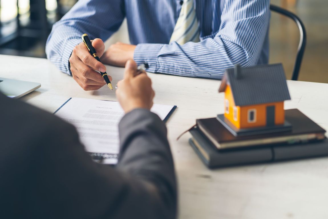 Real estate home are pointing to insurance contract signing