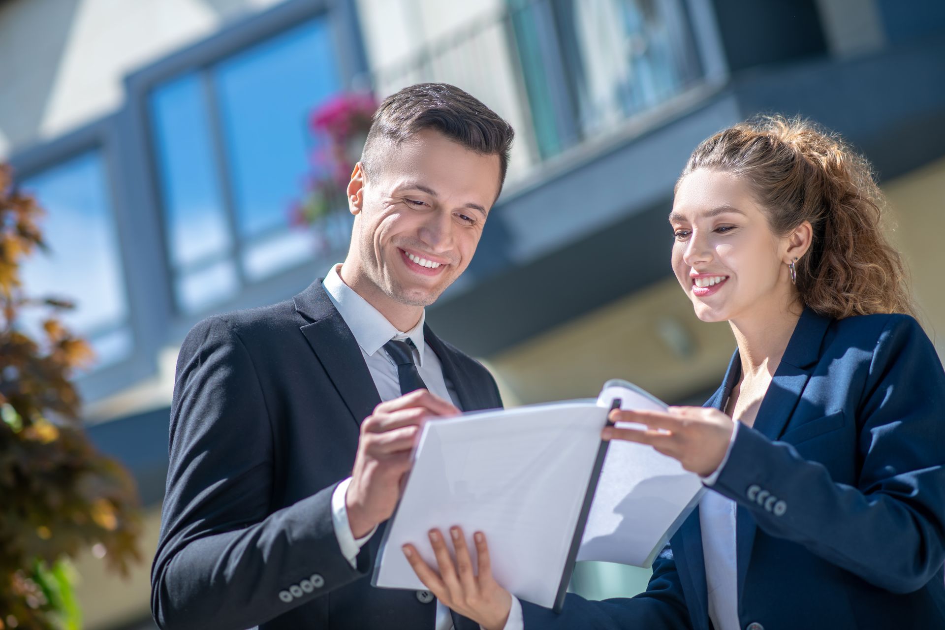 Well-dressed male client signing the documents