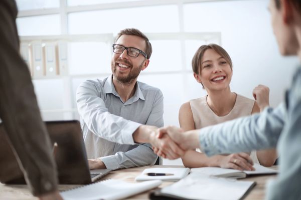 Business man shaking hands with his colleague