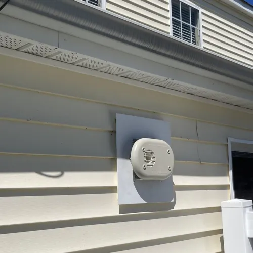 A white box on the side of a white house | The Duke Of Plumbing