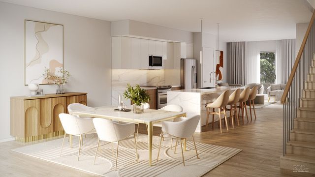 Bright modern dining room with white chairs, wood floors, and a staircase beside an open kitchen