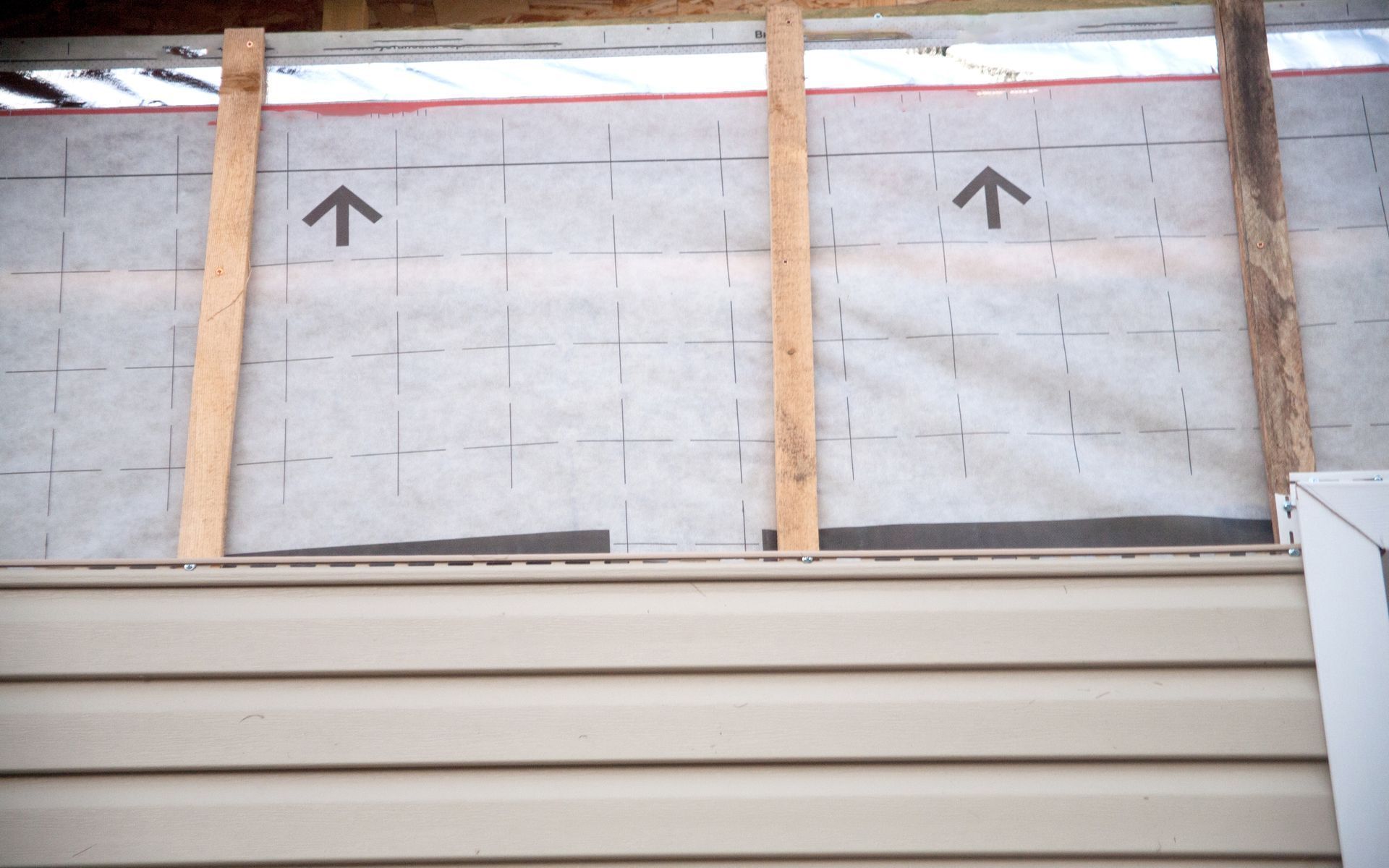 a close up of a siding on a house being installed .