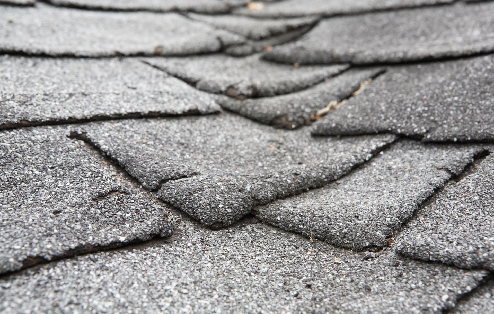 a close up of a roof with a lot of shingles on it .