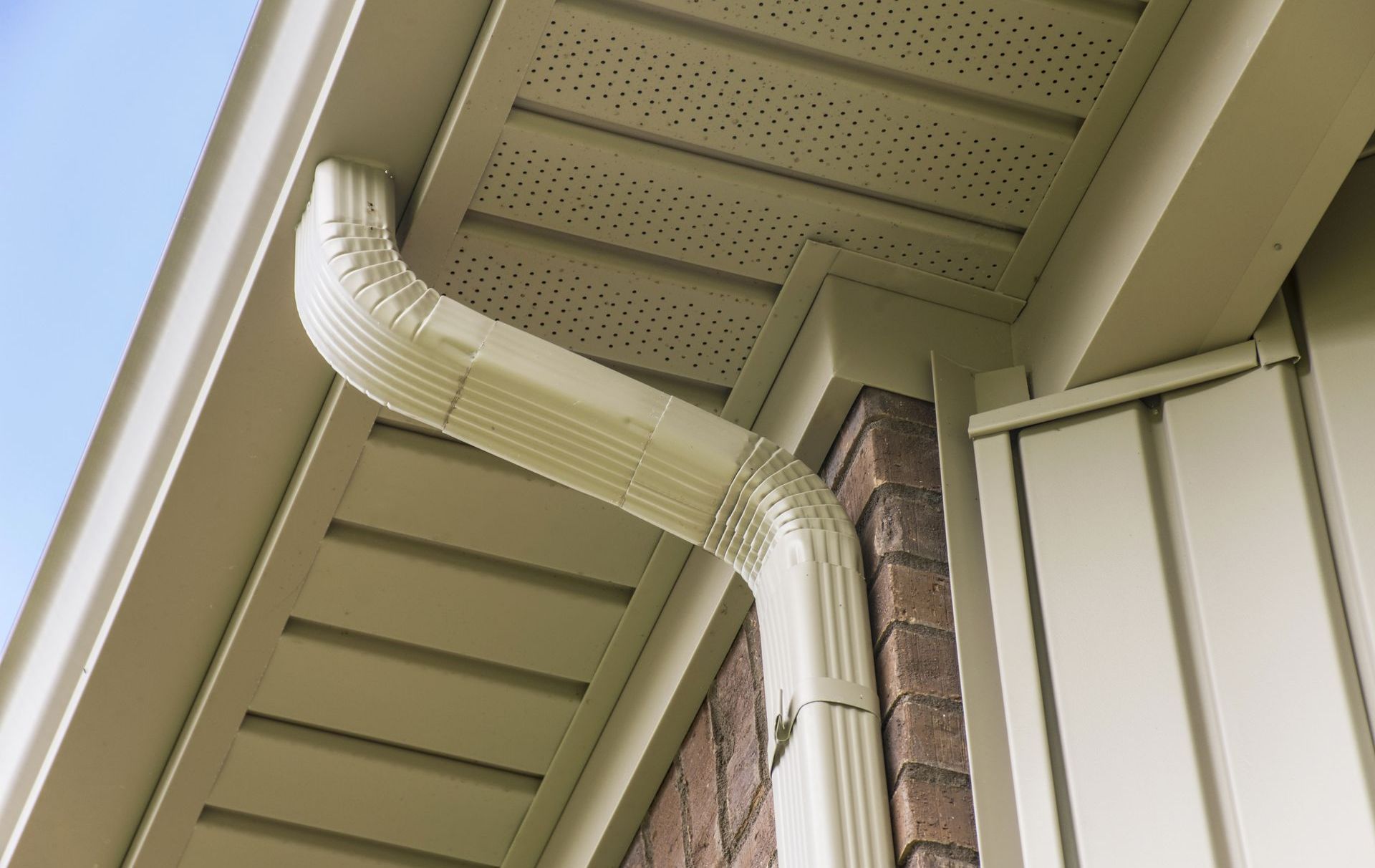 a close up of a gutter on the side of a house .