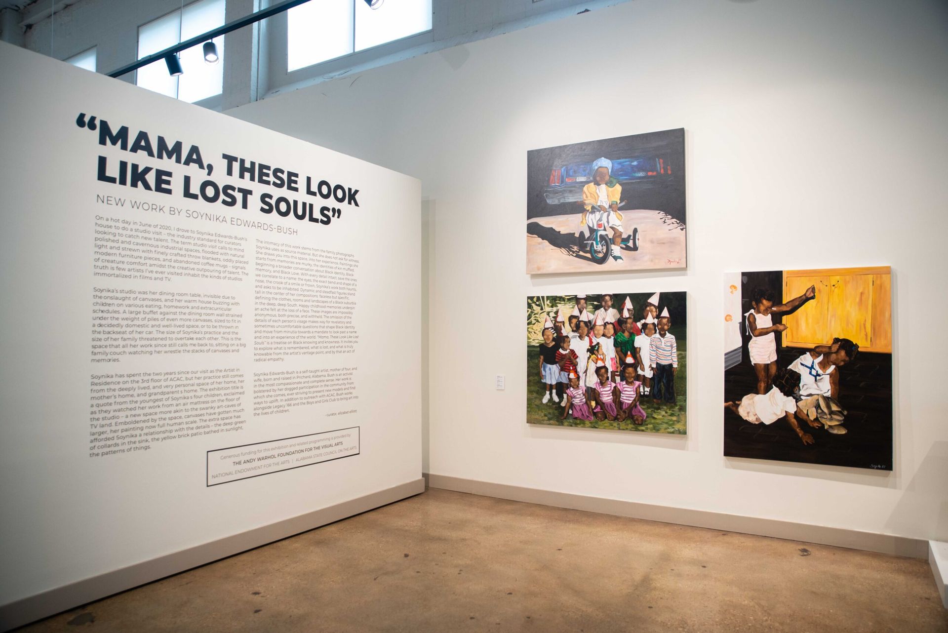 Art gallery wall with “MAMA, THESE LOOK LIKE LOST SOULS” text and three framed photos.