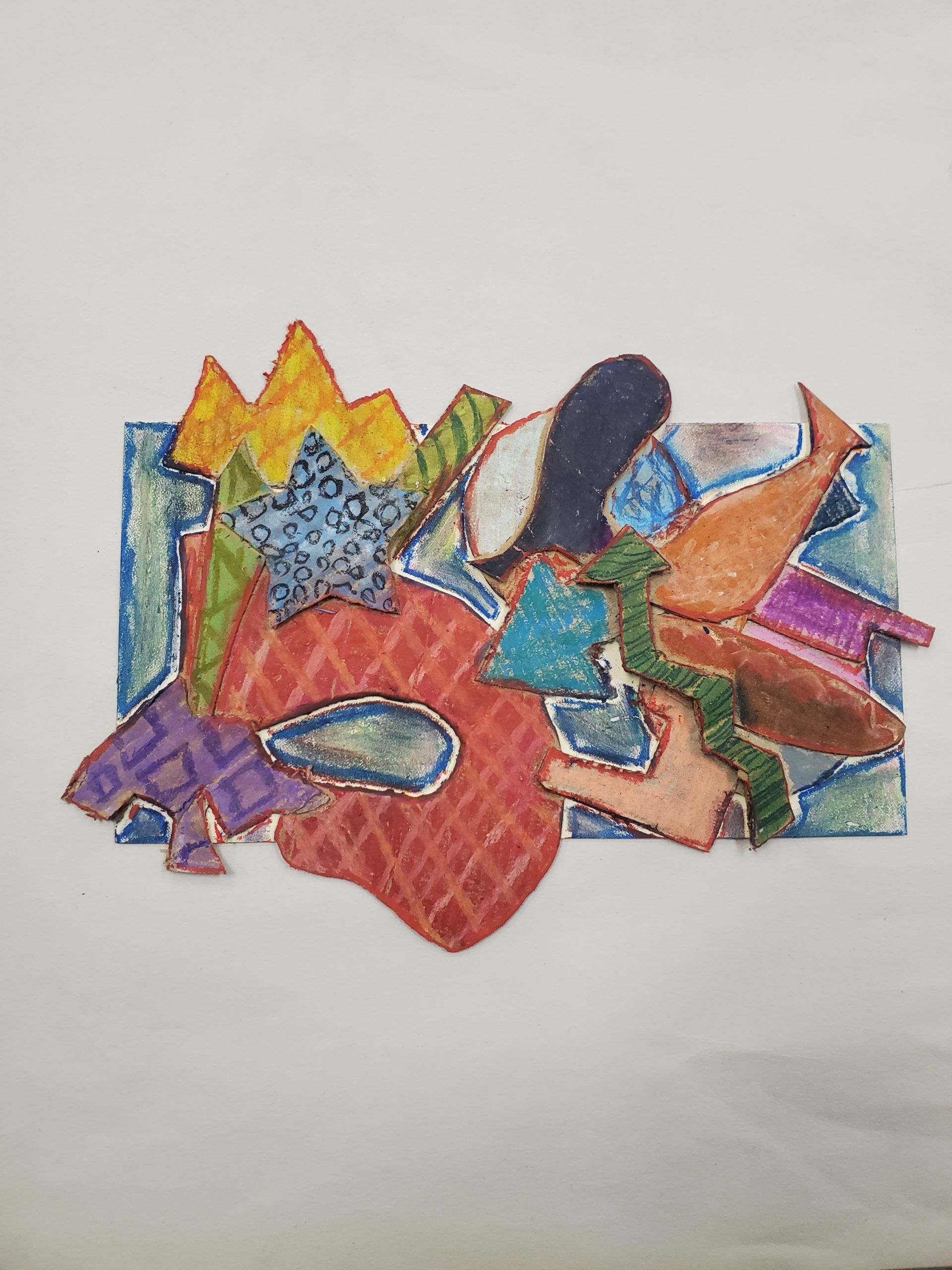 Colorful abstract collage of overlapping cut-out shapes in blue, orange, red, yellow, and green on white paper