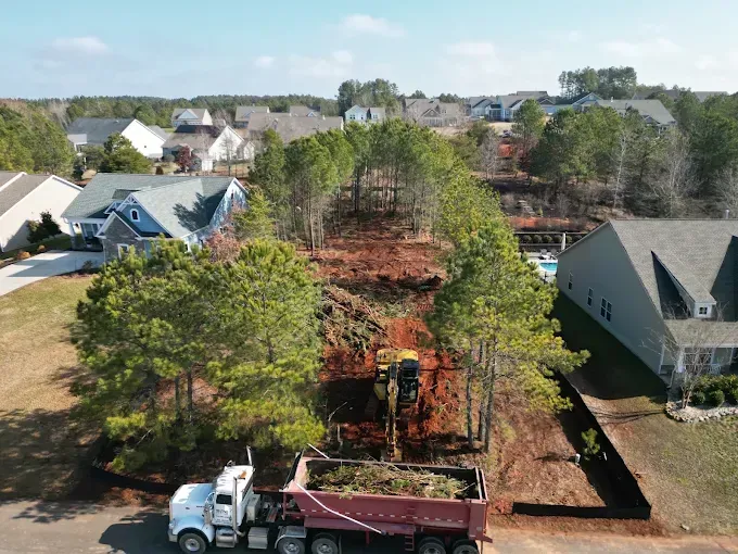 Aerial view of clearing and excavation between homes
