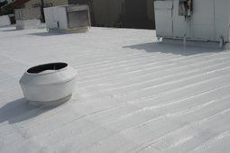 Building With White Roof Coating — Gretna, LA — Brandt Industries