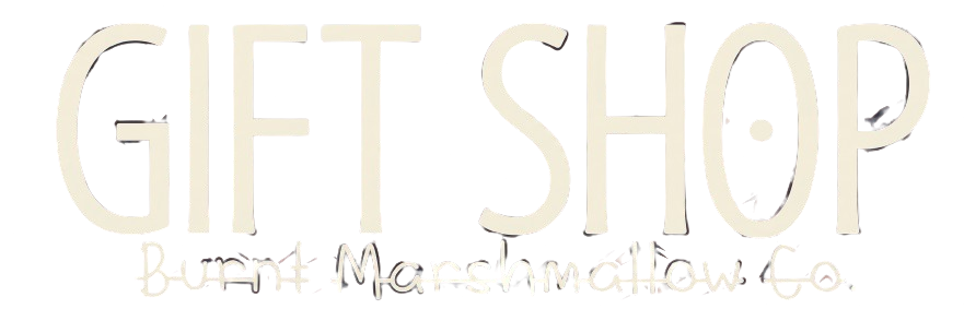 Cream “GIFT SHOP” logo with a faint decorative script tagline underneath