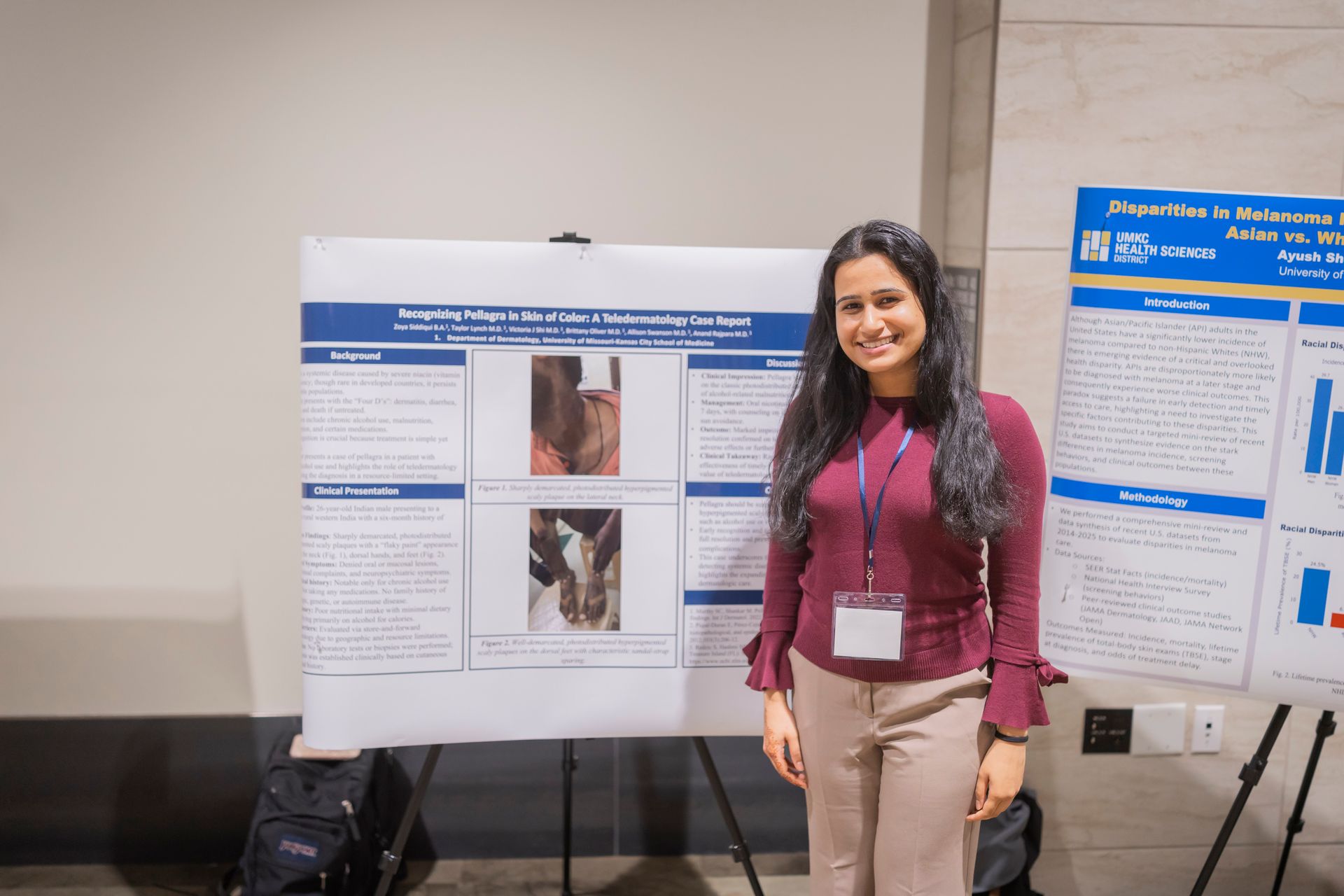 Woman standing in front of a research poster display at a conference