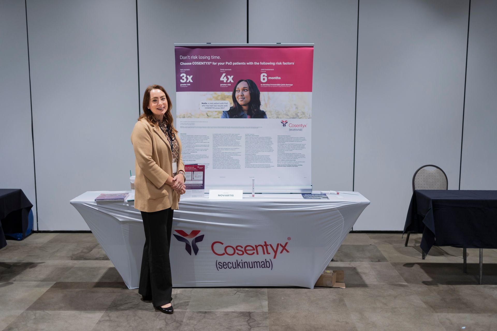 A woman is standing in front of a casemyx table