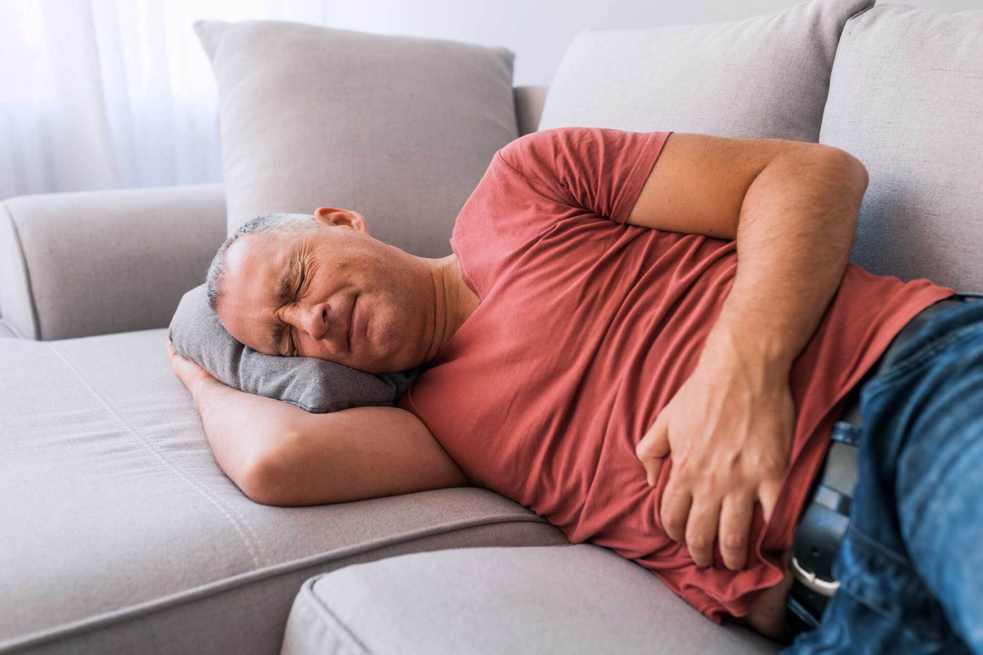 Man Suffering from Stomachache — Portage, MI — Cornerstone Chiropractic Center