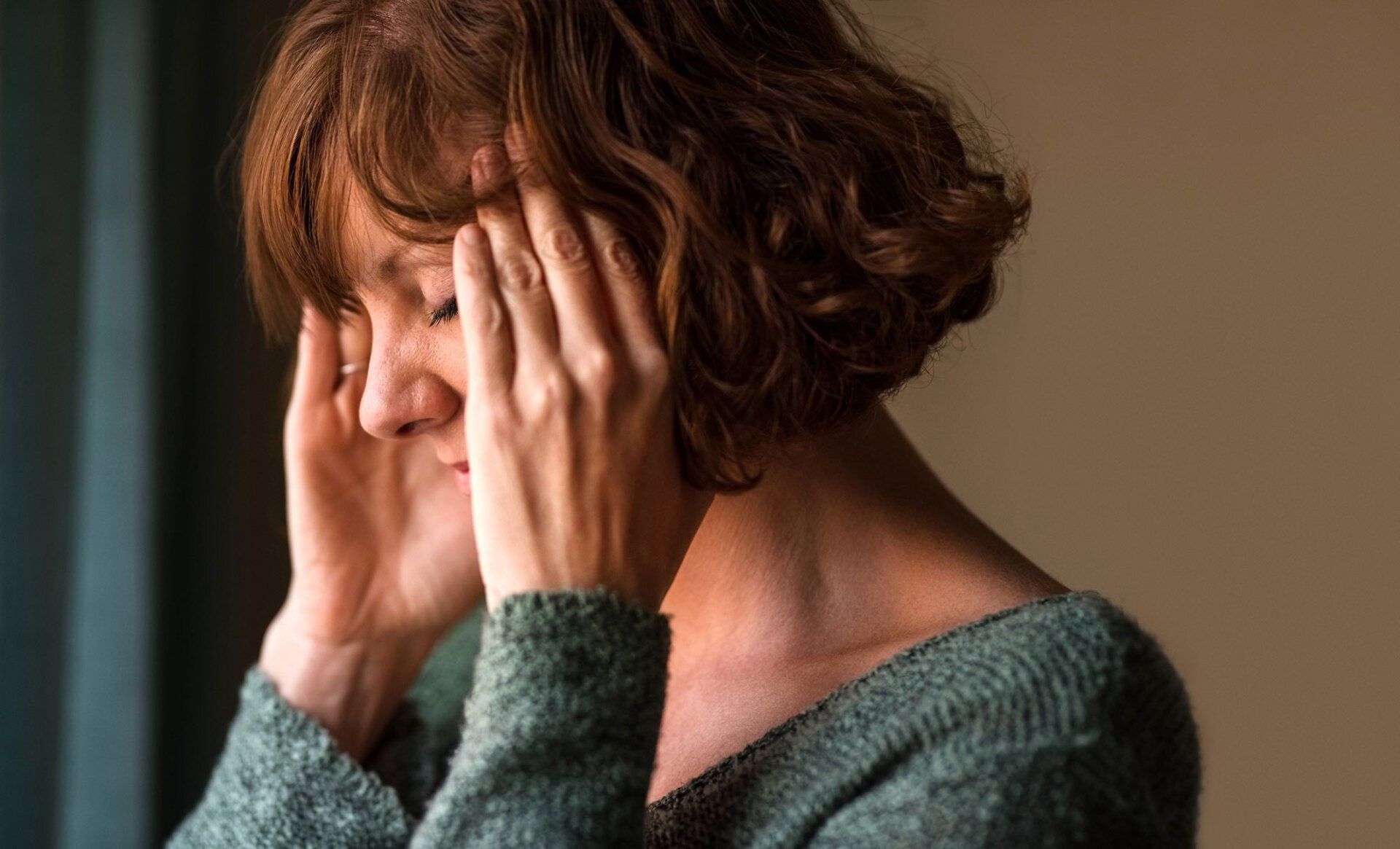Woman Suffering from a Headache — Portage, MI — Cornerstone Chiropractic Center