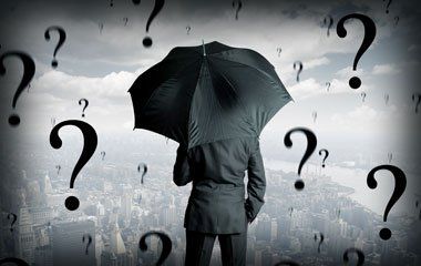 Man Holding Black Umbrella — Portage, MI — Cornerstone Chiropractic Center