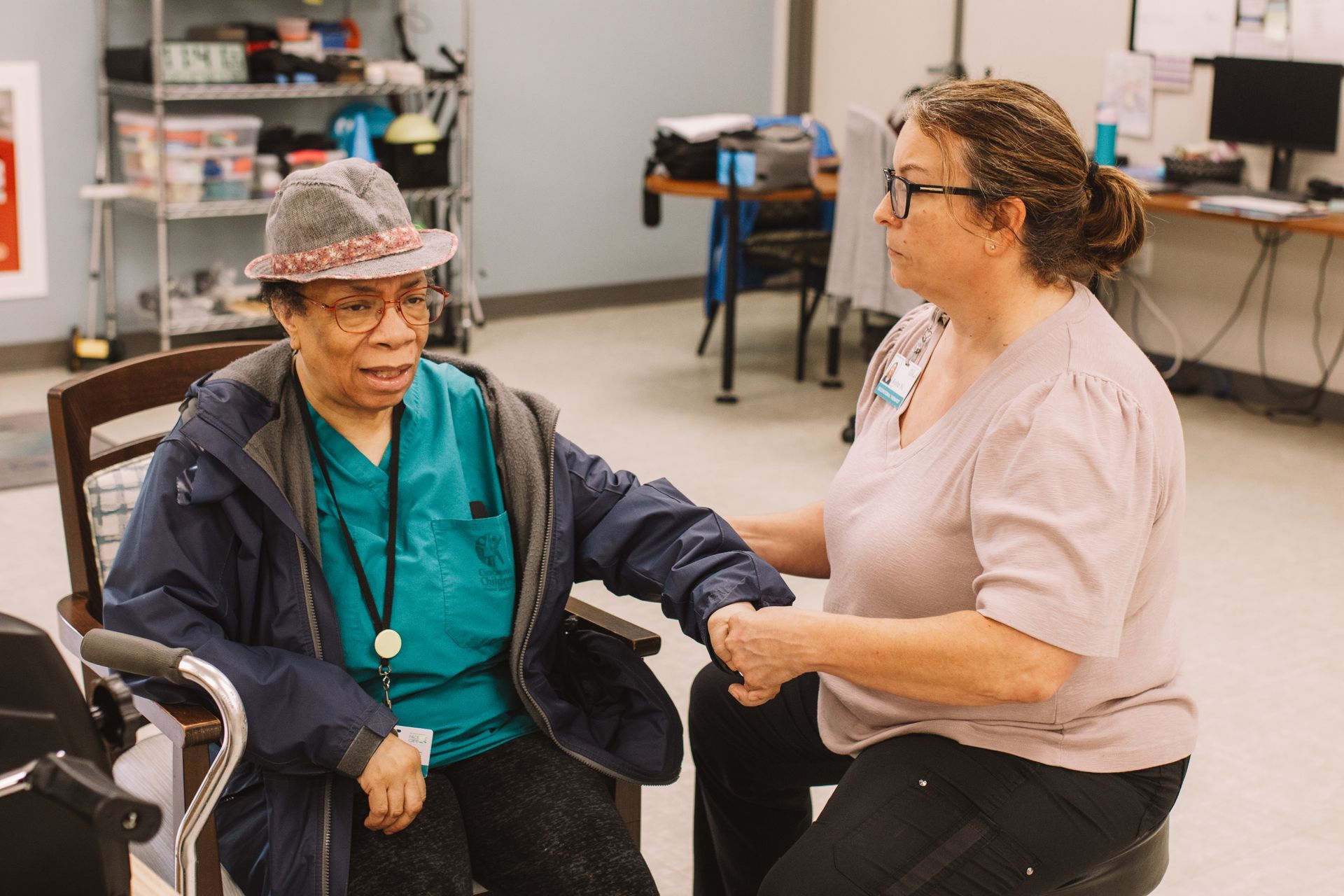 PACE team member assists a participant with physical therapy exercises.
