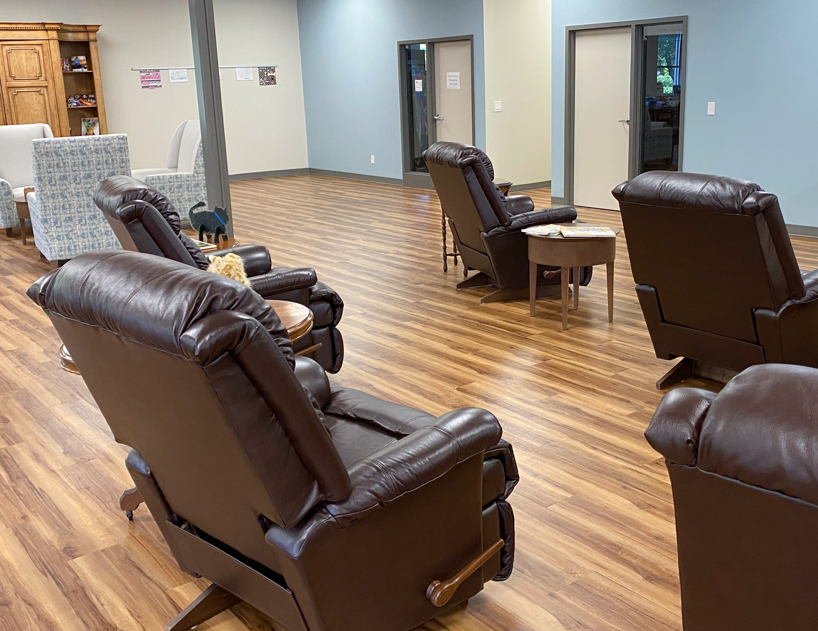 Comfortable recliners arranged in an Entertainment Room at PACE Center.
