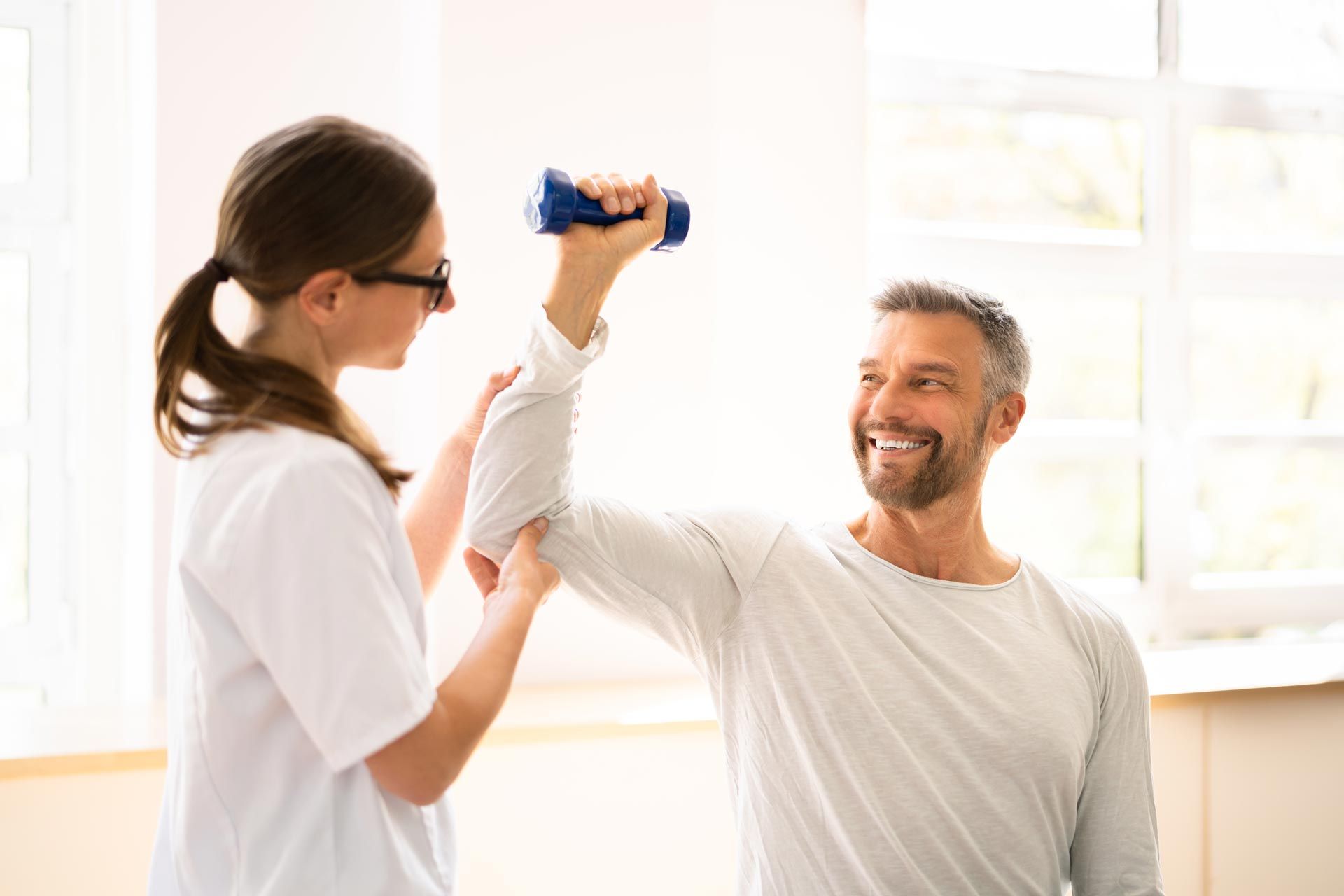 Physical-Rehabilitation-Therapist-Helping-Man
