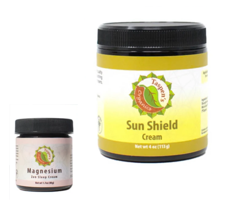 A jar of sun shield cream next to a smaller jar of magnesium cream