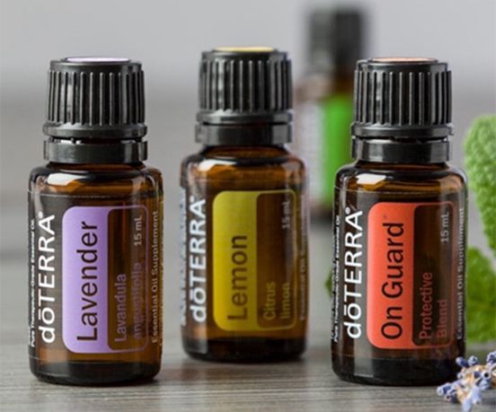 Three bottles of doterra essential oils lavender lemon and on guard