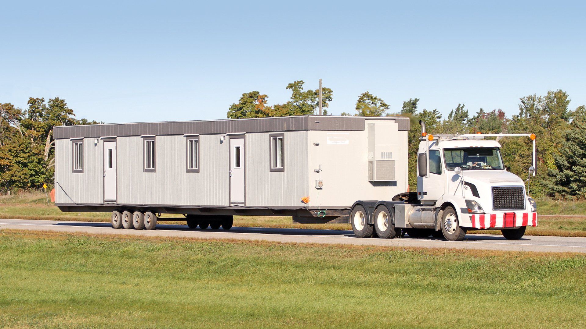 Mobile home moving on the back of truck | Colorado Springs, CO | Dennie Murr Mobile LLC