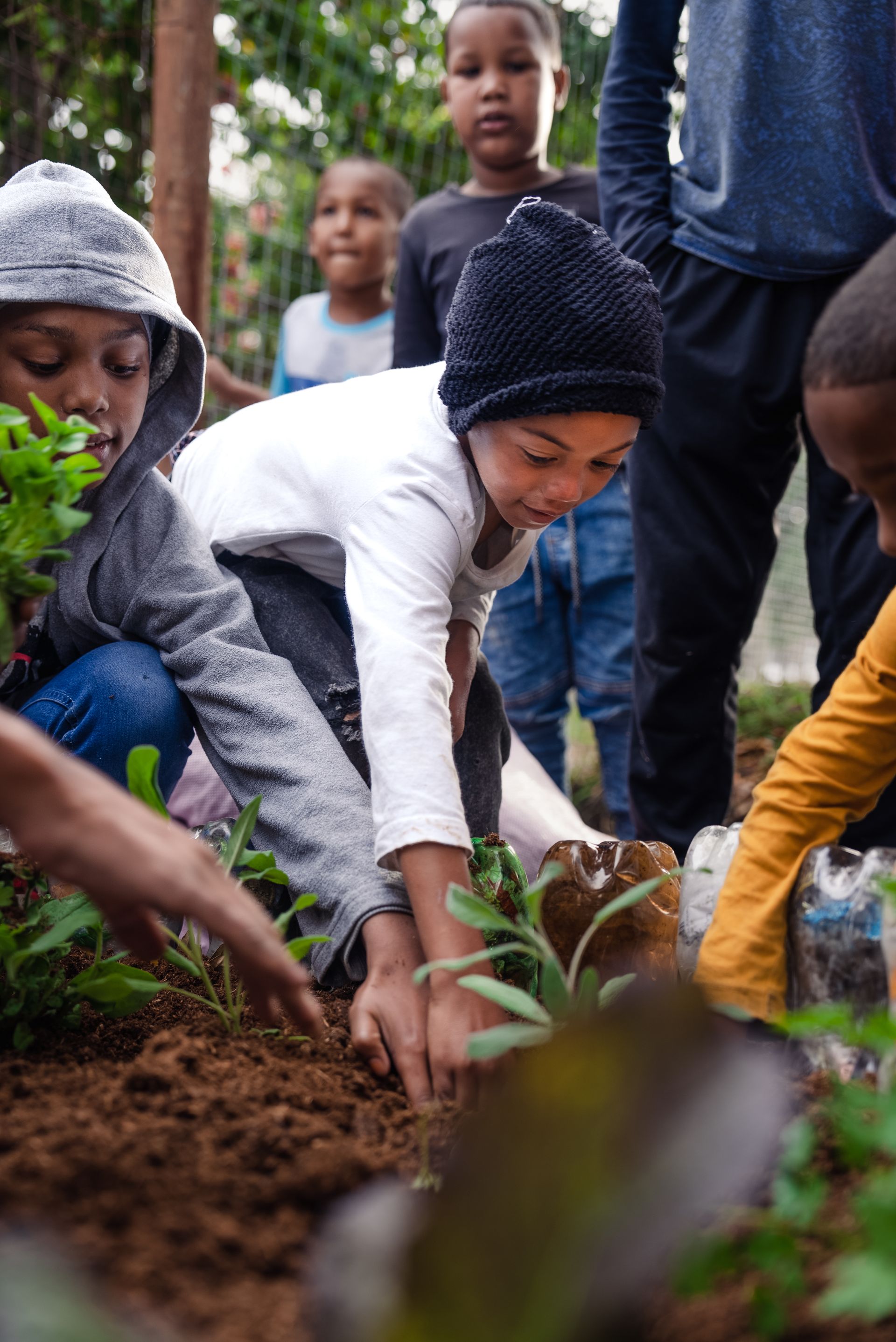 Children learning composting at the Valley of Plenty