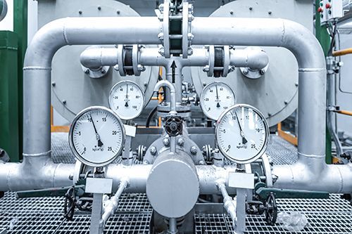 A Close Up Of A Machine With A Lot Of Pipes And Gauges - Oklahoma City, OK - Total Pump & Supply A Close Up Of A Machine With A Lot Of Pipes And Gauges - Oklahoma City, OK - Total Pump & Supply
