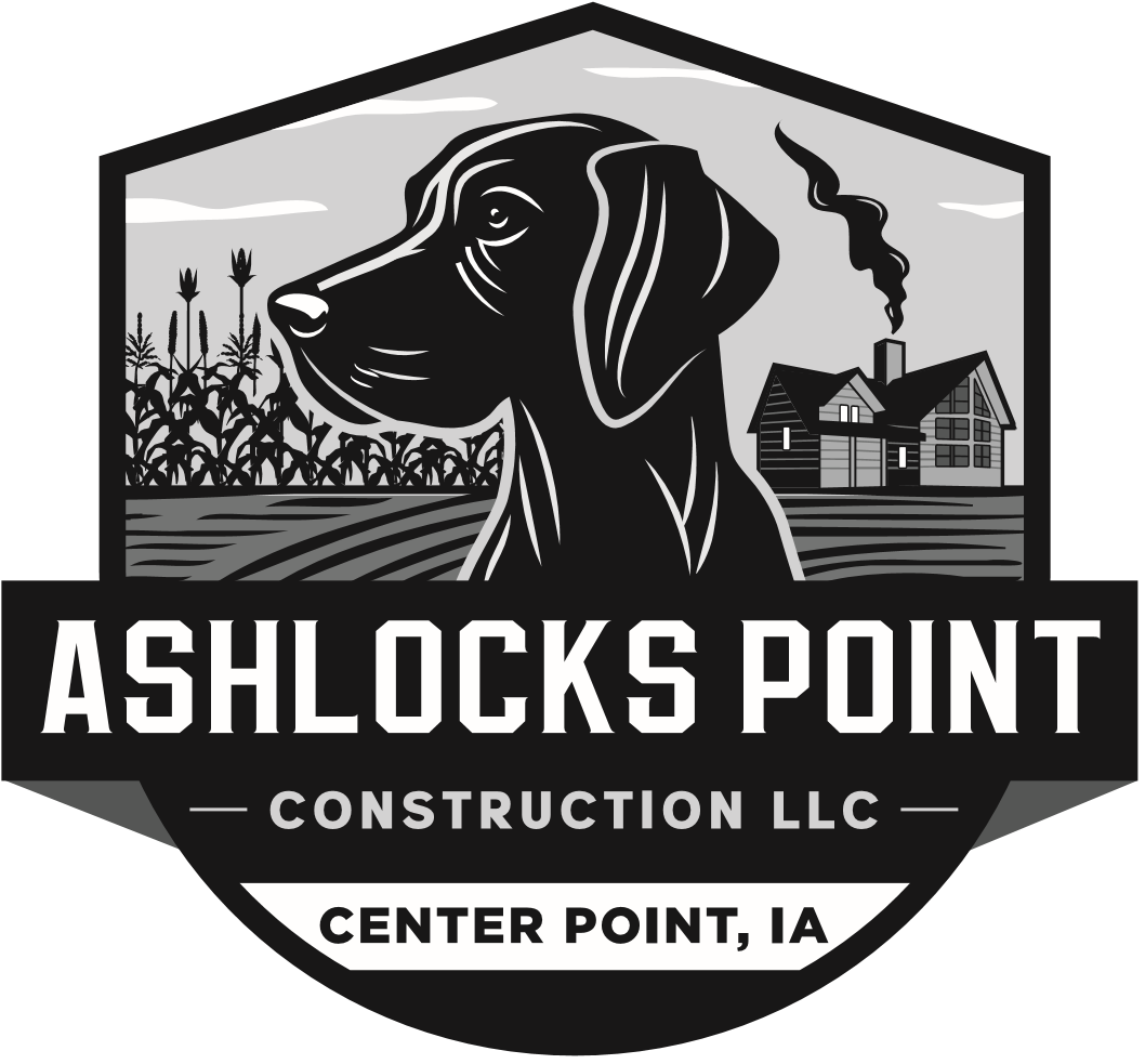 A black and white logo for ashlocks point construction llc