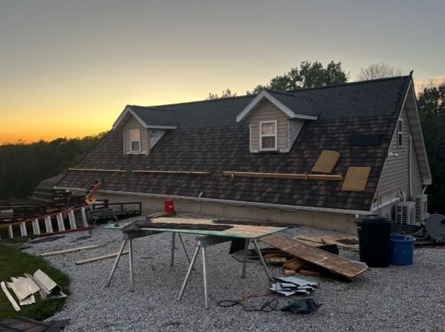 A house with a roof that is being worked on
