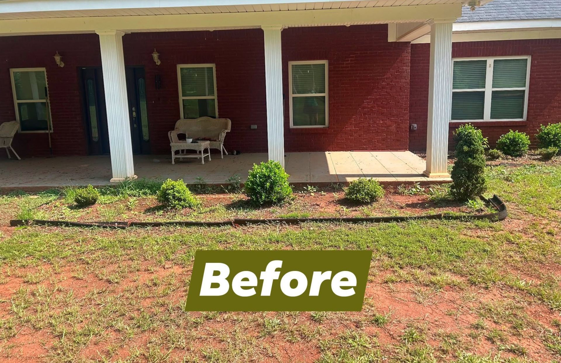 Front porch of a brick house with white columns, potted plants, and a bench; “Before” label on the lawn.