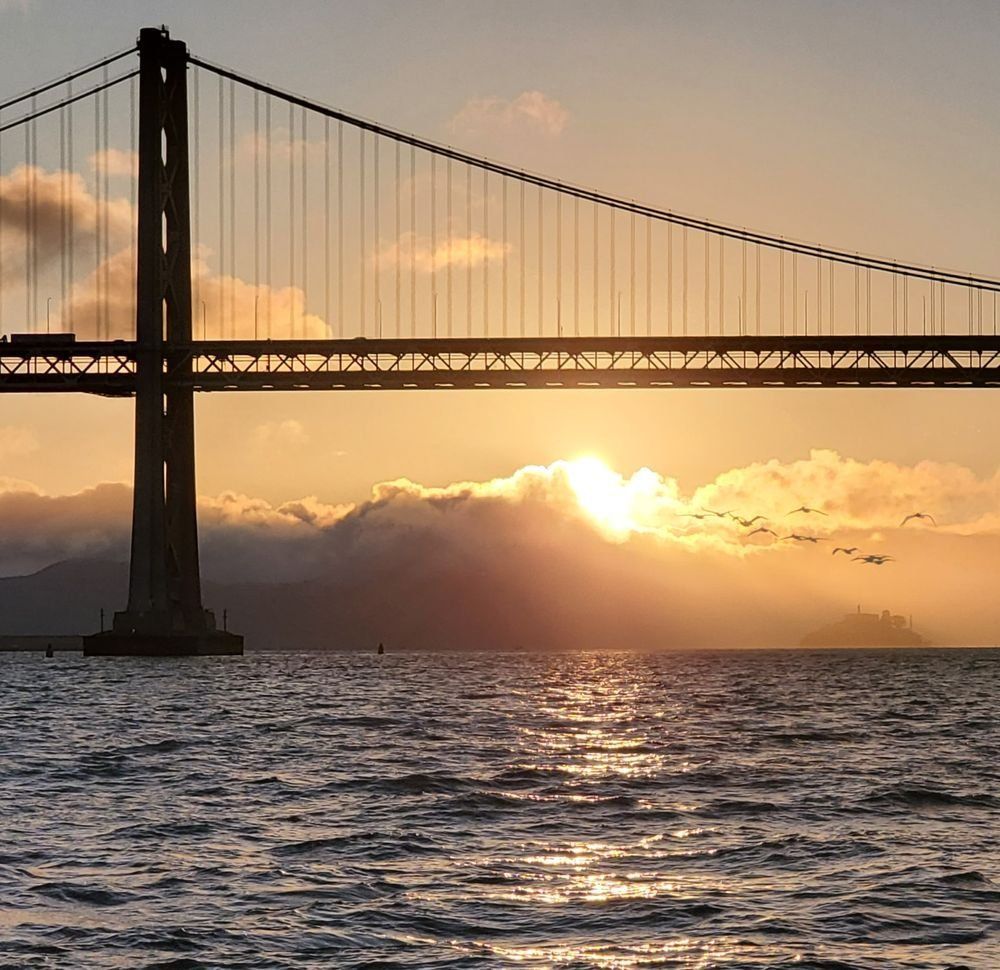 Golden Gate Bridge sunset sailing ash scattering ceremony