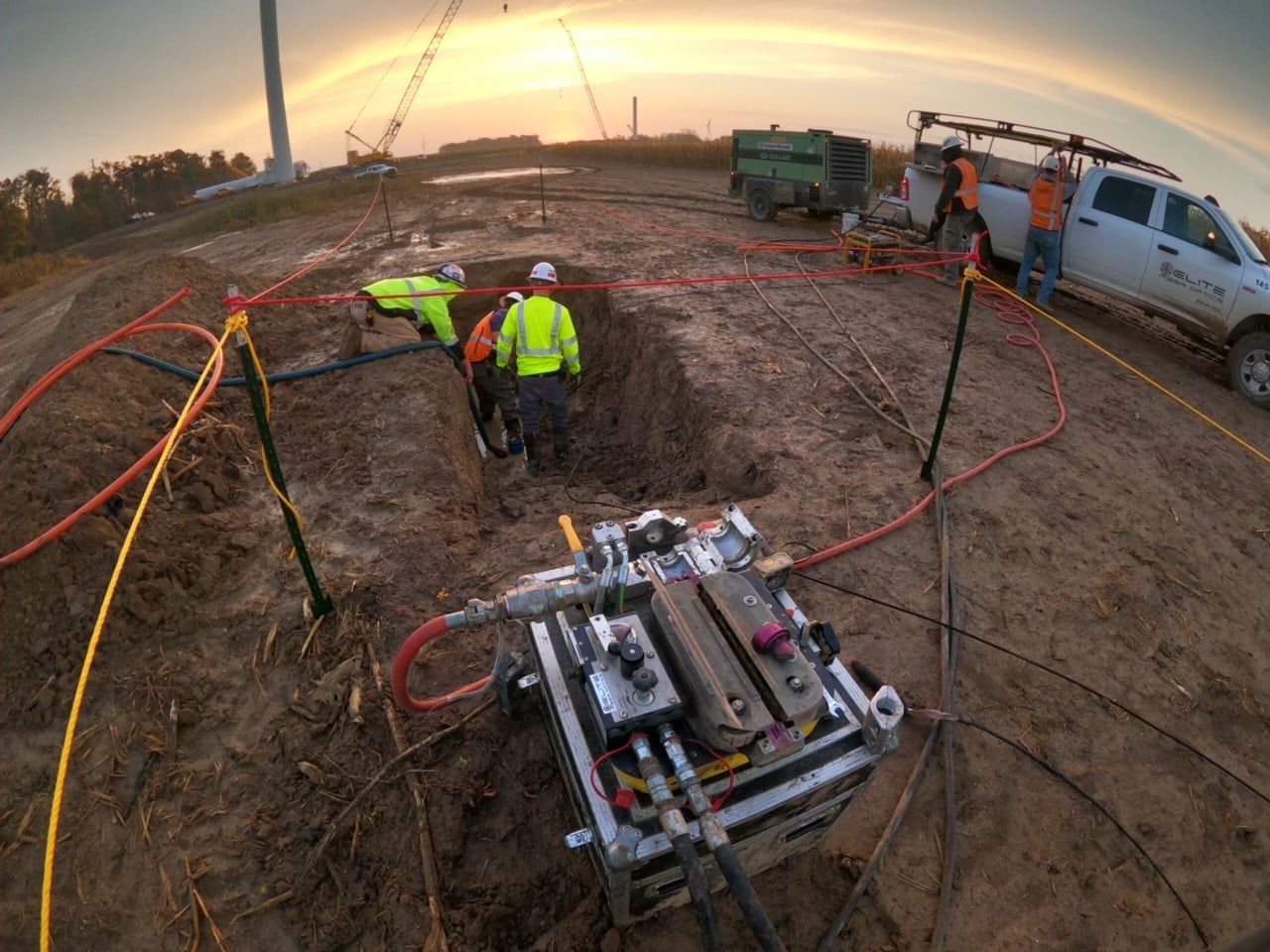 A group of construction workers are working on a construction site.