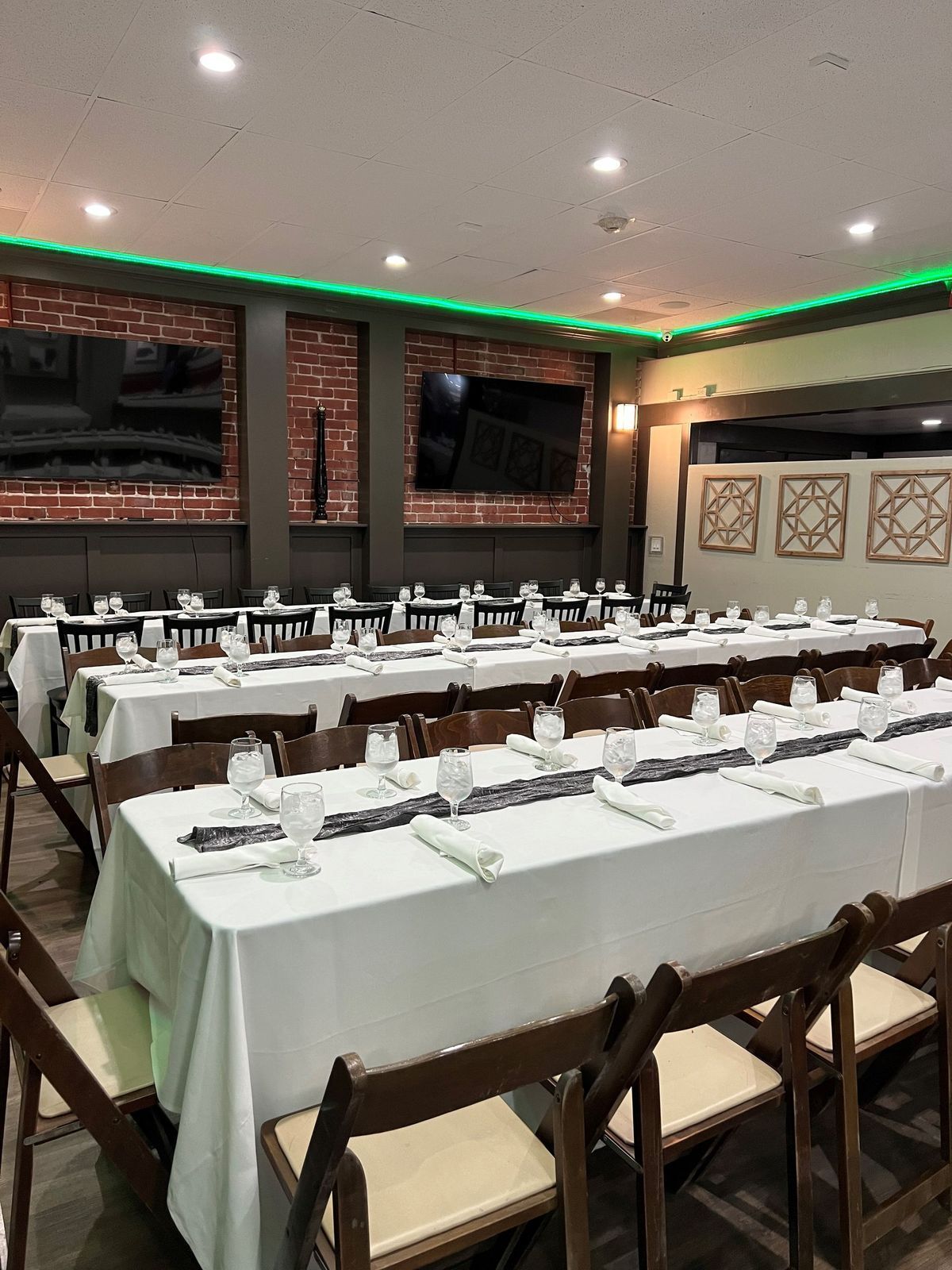A large room with tables and chairs set up for a party.