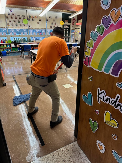 Man mopping a classroom floor near me in Cleveland, OH
